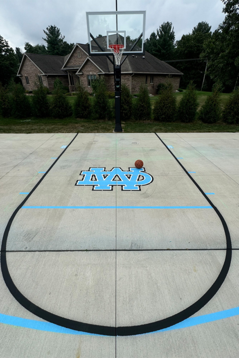 Fresh Painted Basketball Court In Driveway
