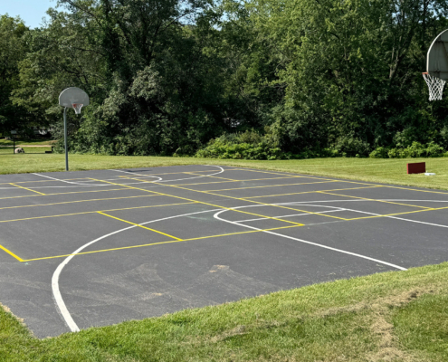 Full Basketball Court Painted On Pavement In Park