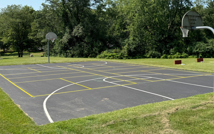 Full Basketball Court Painted On Pavement In Park