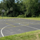 Full Basketball Court Painted On Pavement In Park