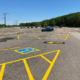 Painted Parking Lot In Front Of Cascade Mountain Sign