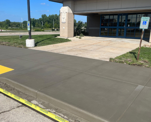 Concrete Sidewalk In Front Of Commercial Building Entrance