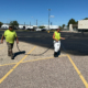 Ssi Workers Painting A Seal Coating On Parking Lot