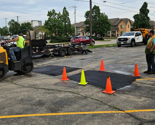 Ssi Workers Repairing Potholes In Parking Lot